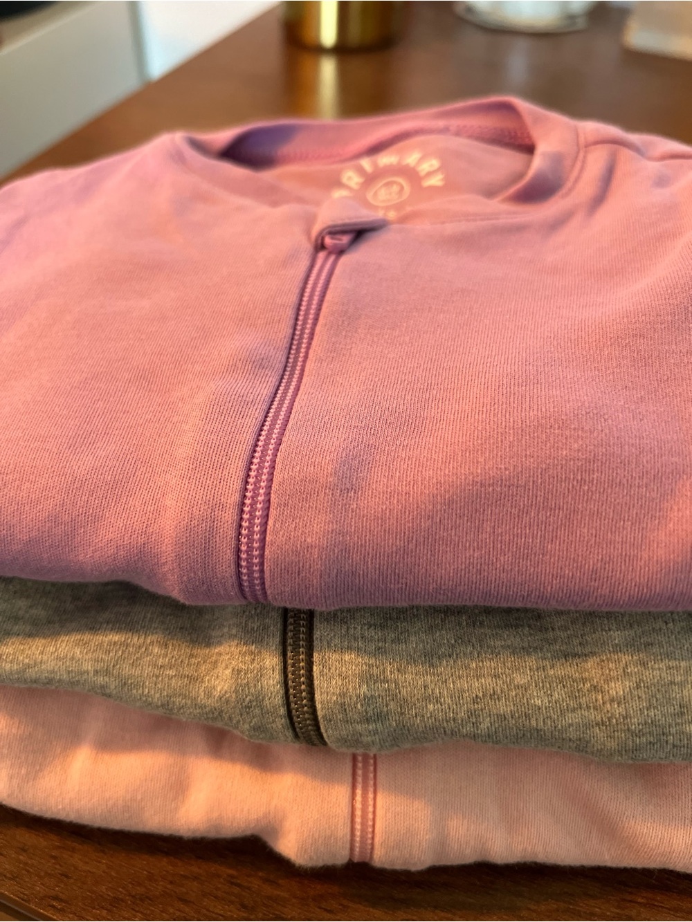 Primary - Three 100% Organic Cotton  Long Sleeve Footed One-Piece